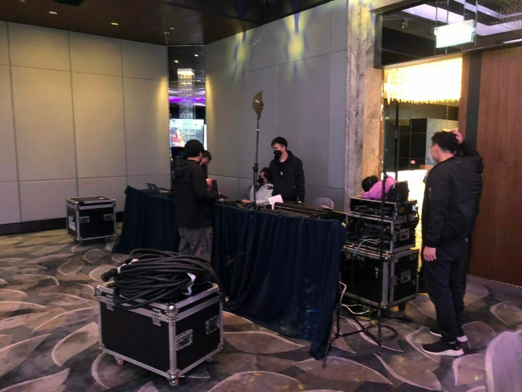 Expert audio and visual technicians testing equipment for the gala.